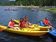 Corporate Group Posing In Kayaks